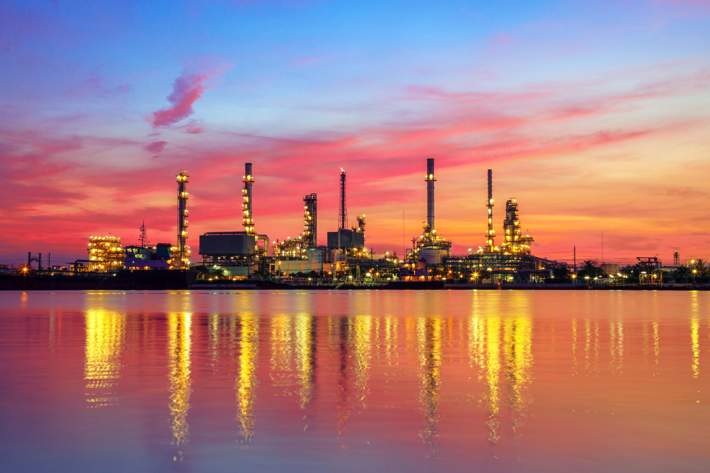 Oil refinery at sunset